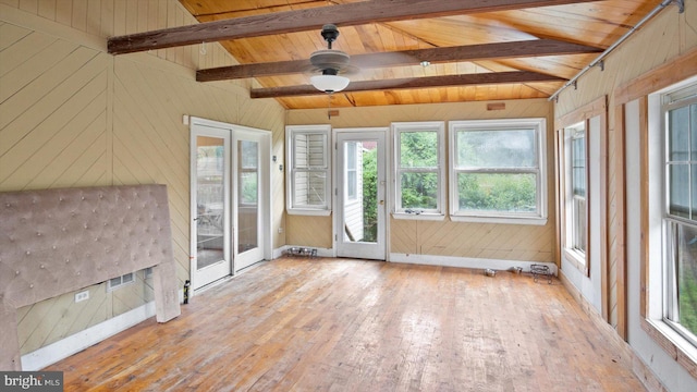 unfurnished sunroom featuring wooden ceiling, lofted ceiling with beams, ceiling fan, and a wealth of natural light