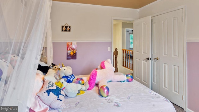 bedroom featuring carpet floors and crown molding