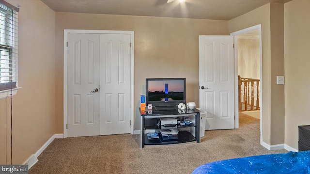 carpeted bedroom with a closet