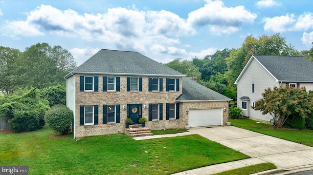 colonial inspired home featuring a front yard