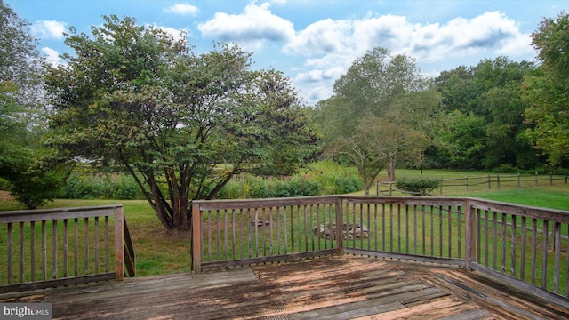 deck featuring a lawn