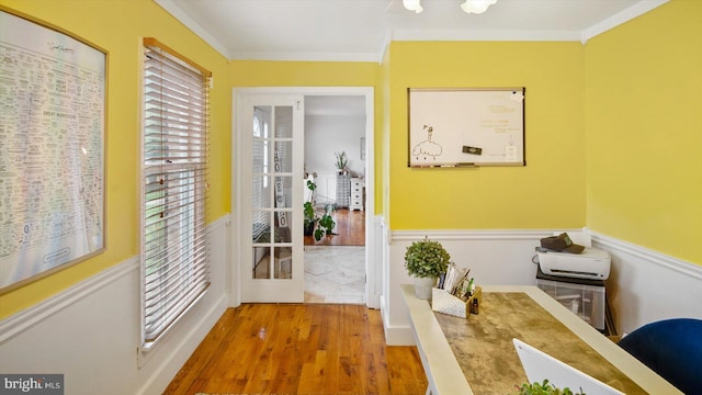 hallway with wood-type flooring and crown molding