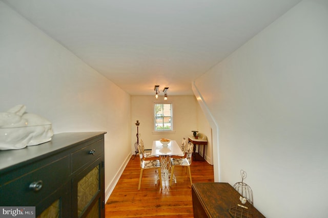 dining room with hardwood / wood-style floors