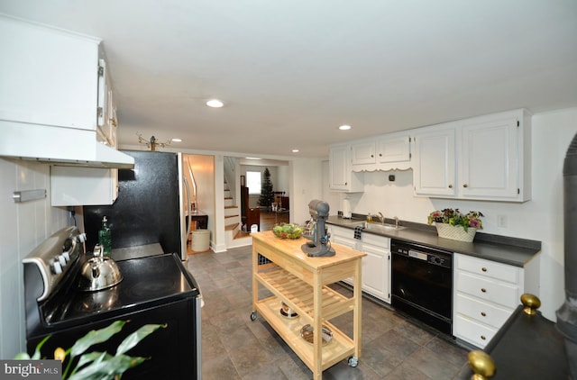 kitchen featuring white cabinetry, fridge, dishwasher, and stainless steel electric range oven