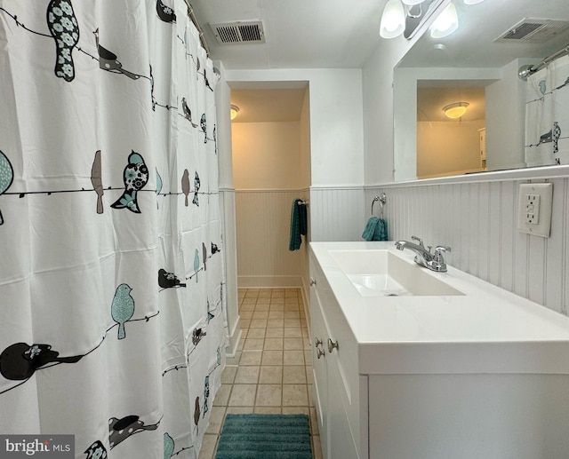 bathroom with vanity, tile patterned flooring, and a shower with shower curtain