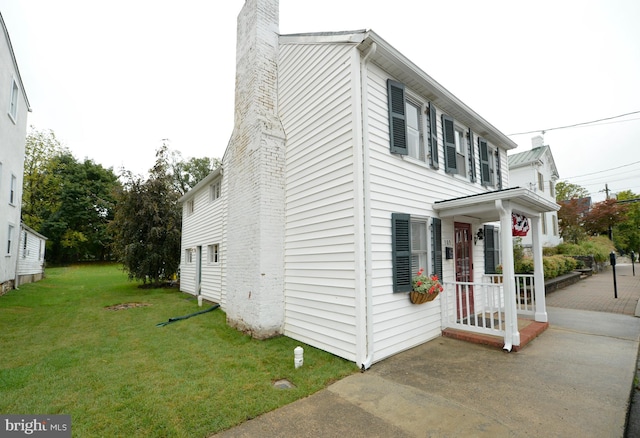 view of property exterior with a yard