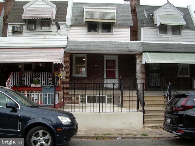 view of property featuring a porch