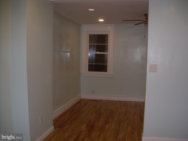 empty room featuring ceiling fan and hardwood / wood-style flooring