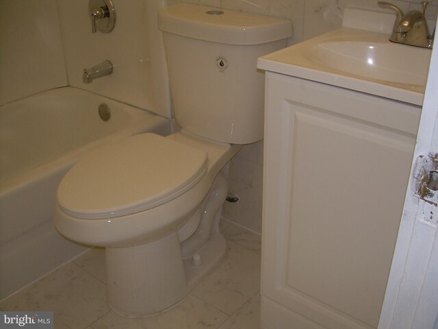 full bathroom featuring vanity, toilet, and  shower combination