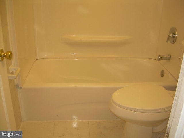 bathroom featuring toilet and tile patterned floors