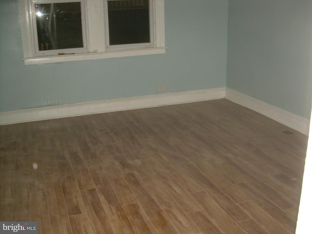 spare room featuring hardwood / wood-style flooring