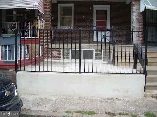 view of gate with a porch