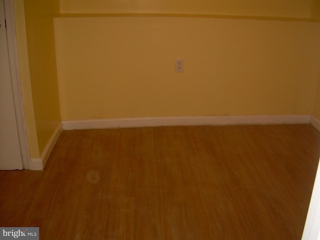 unfurnished room featuring wood-type flooring