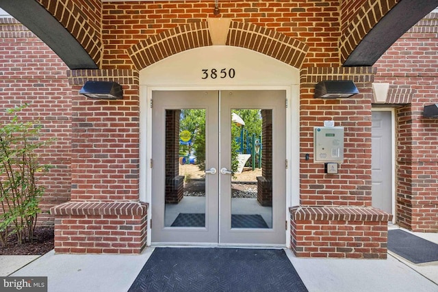 view of exterior entry featuring french doors