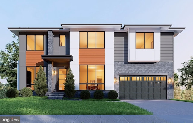 view of front facade with a garage and a front lawn