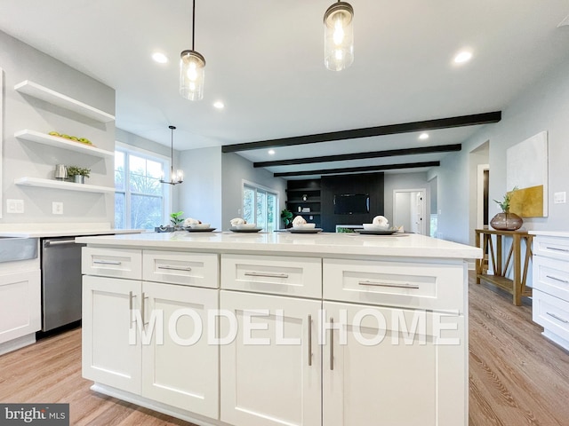 kitchen with white cabinetry, light hardwood / wood-style flooring, beamed ceiling, and stainless steel dishwasher