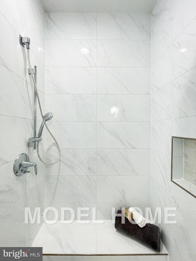 bathroom featuring tiled shower