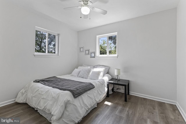 bedroom featuring ceiling fan and dark hardwood / wood-style floors