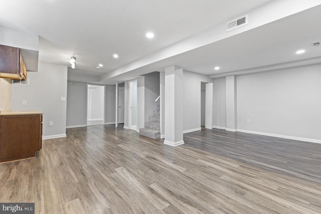 unfurnished living room with hardwood / wood-style floors