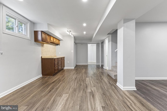 basement featuring dark hardwood / wood-style floors