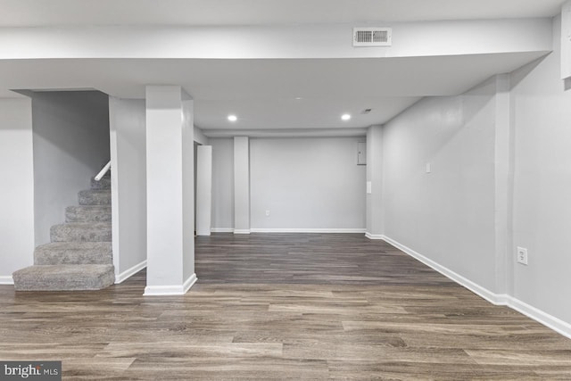 basement with hardwood / wood-style flooring