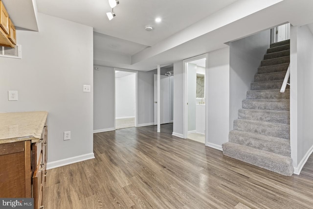 basement featuring hardwood / wood-style floors