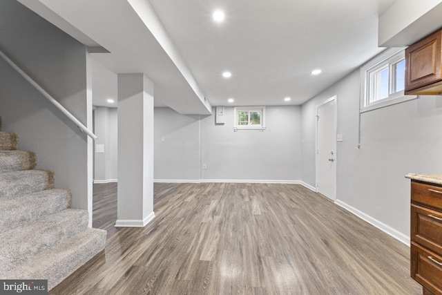 basement featuring hardwood / wood-style floors