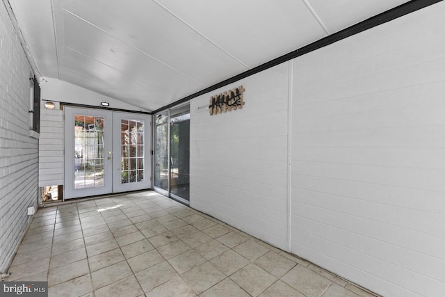 unfurnished sunroom featuring french doors and vaulted ceiling