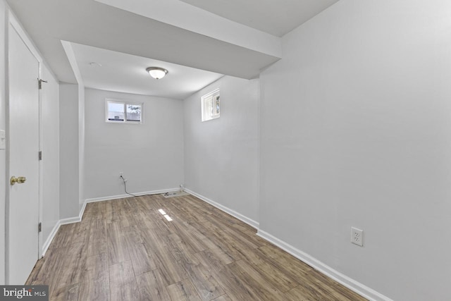 basement featuring hardwood / wood-style floors