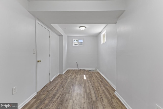 hall with hardwood / wood-style floors