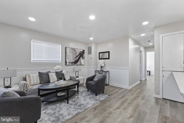 living room with light hardwood / wood-style flooring