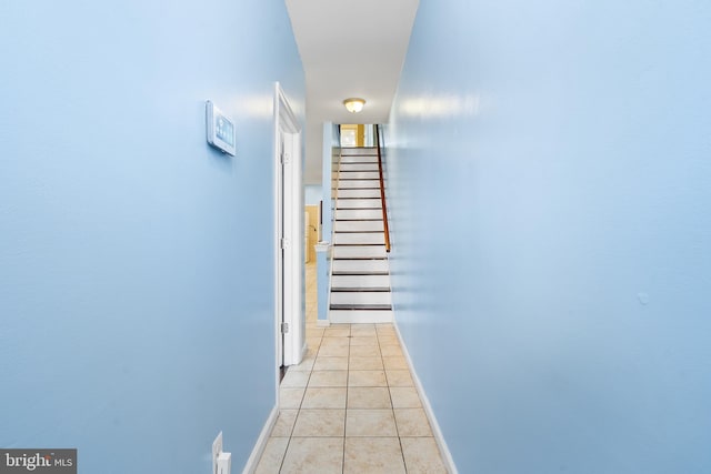 corridor with light tile patterned flooring