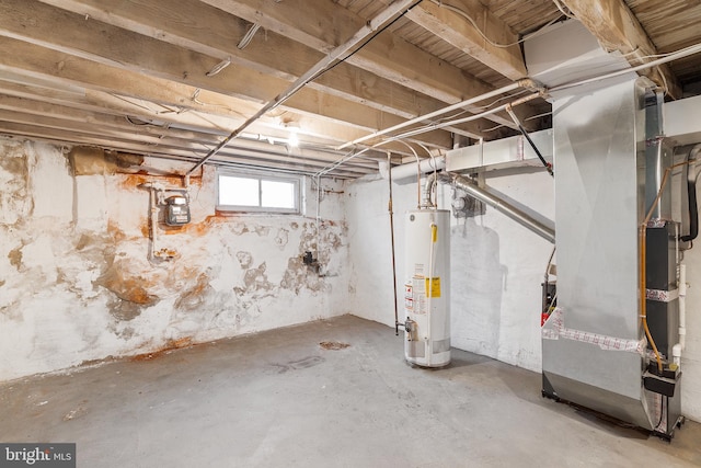 basement featuring gas water heater and heating unit