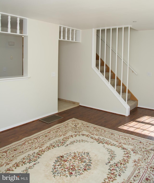 unfurnished room featuring dark hardwood / wood-style floors