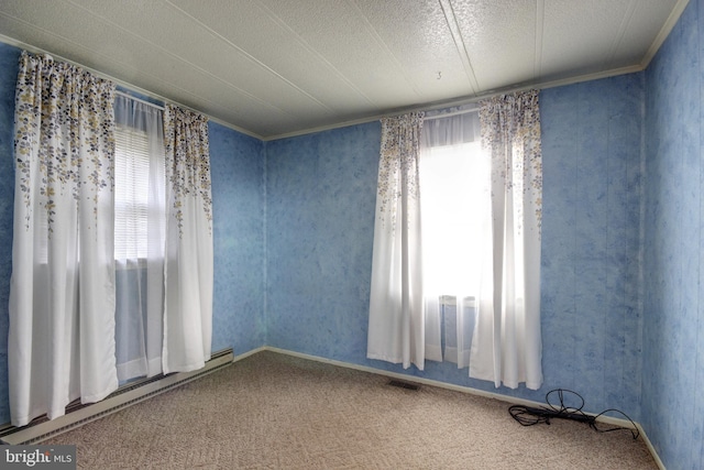 unfurnished room featuring a baseboard radiator, ornamental molding, and carpet floors