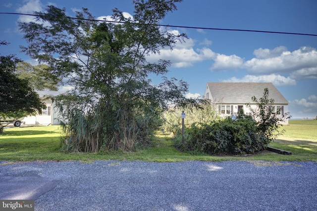 view of property exterior with a lawn