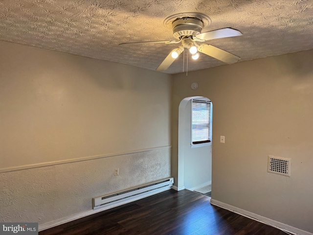 spare room featuring a baseboard radiator, a textured ceiling, ceiling fan, and dark hardwood / wood-style flooring