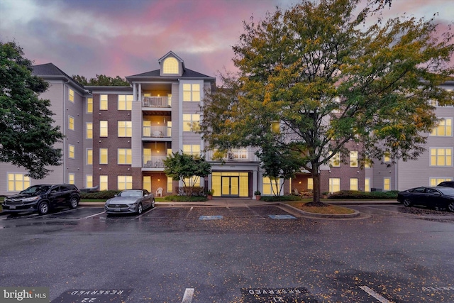 view of outdoor building at dusk