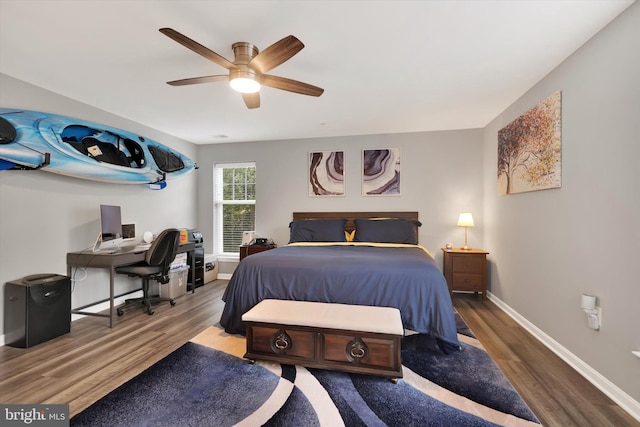 bedroom featuring wood-type flooring and ceiling fan