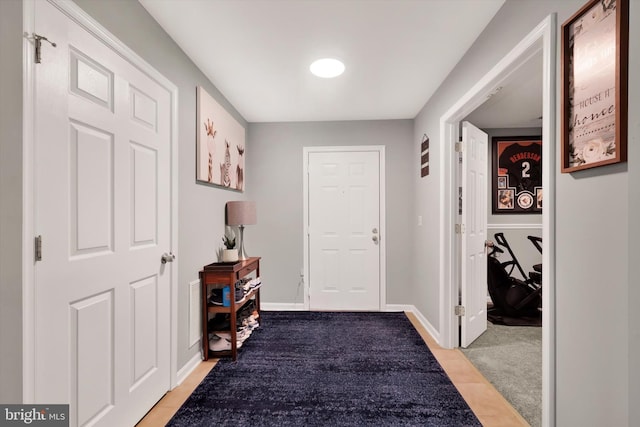 hall with light tile patterned flooring