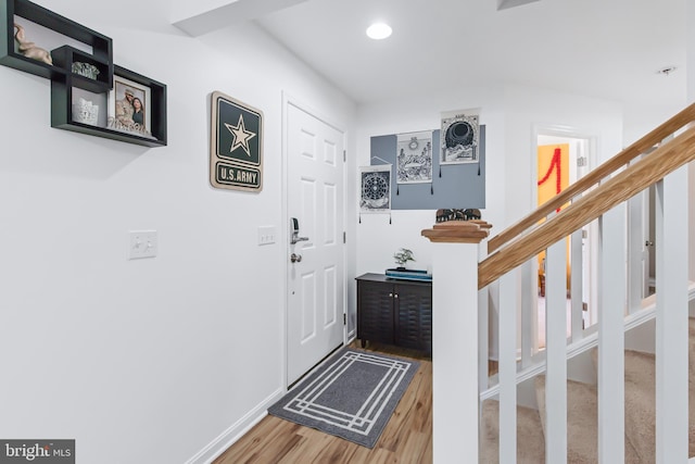 entryway with hardwood / wood-style flooring