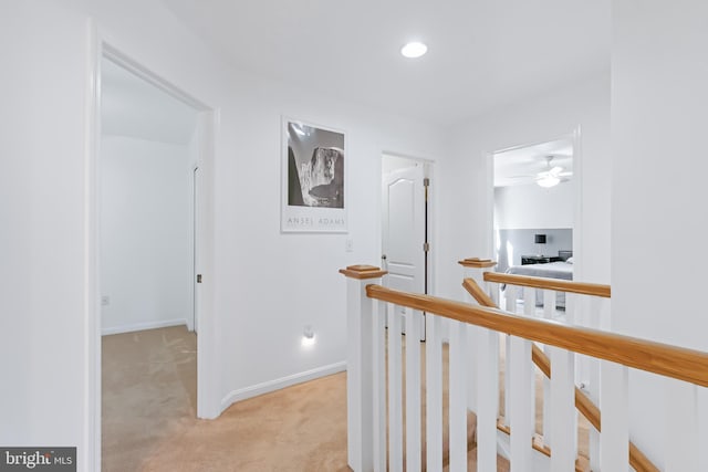 hallway with light carpet