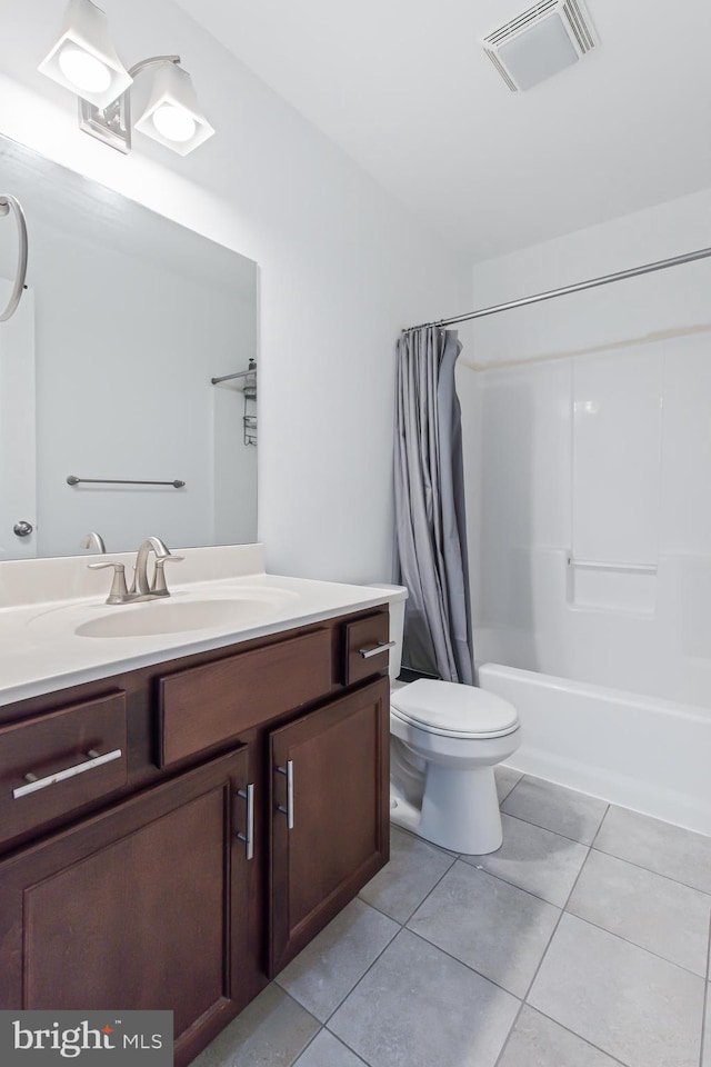 full bathroom with shower / bathtub combination with curtain, tile patterned floors, vanity, and toilet