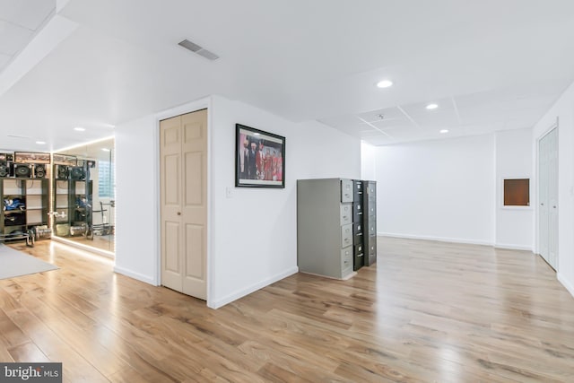 unfurnished room with light wood-type flooring