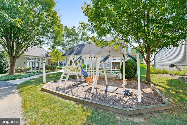 view of playground with a lawn