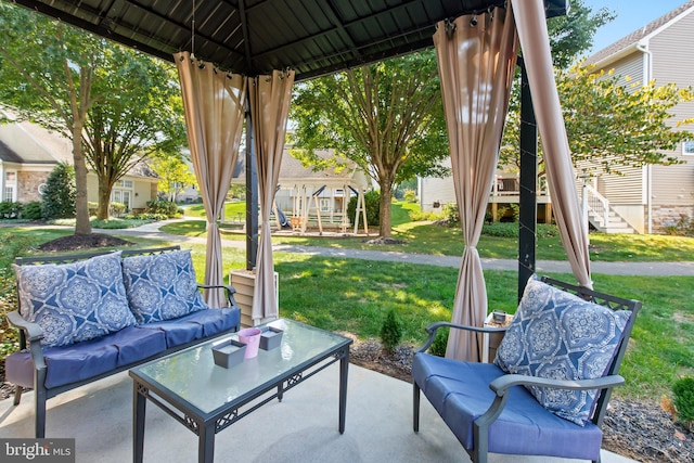 view of patio / terrace with an outdoor living space and a gazebo