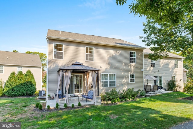 back of house featuring a patio, a yard, an outdoor living space, a gazebo, and cooling unit