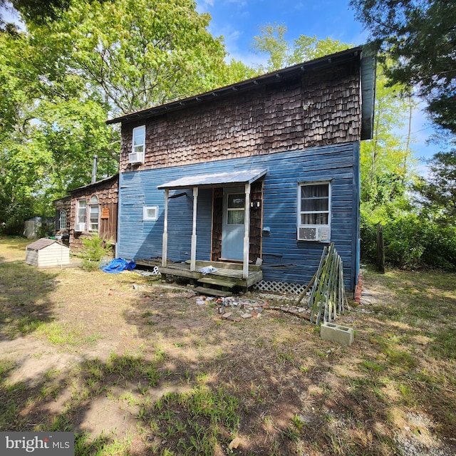 back of house with cooling unit