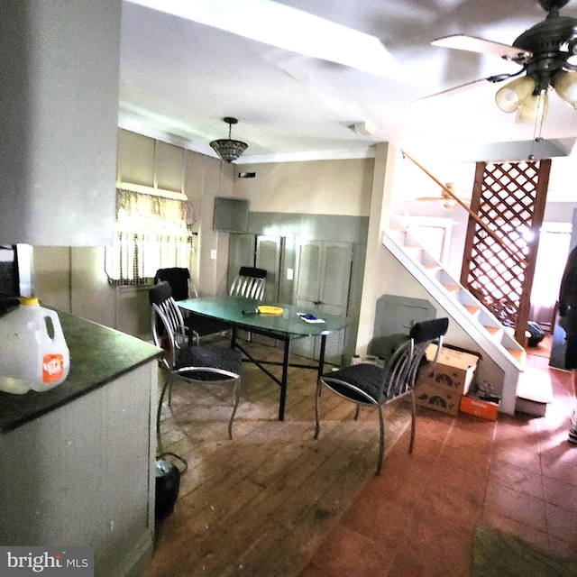 interior space with ceiling fan and hardwood / wood-style flooring