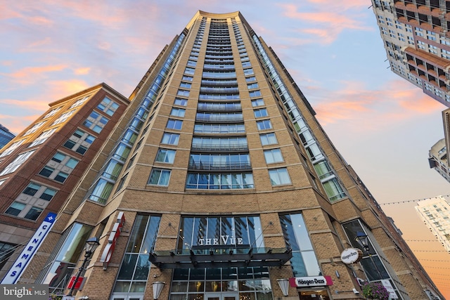 view of outdoor building at dusk